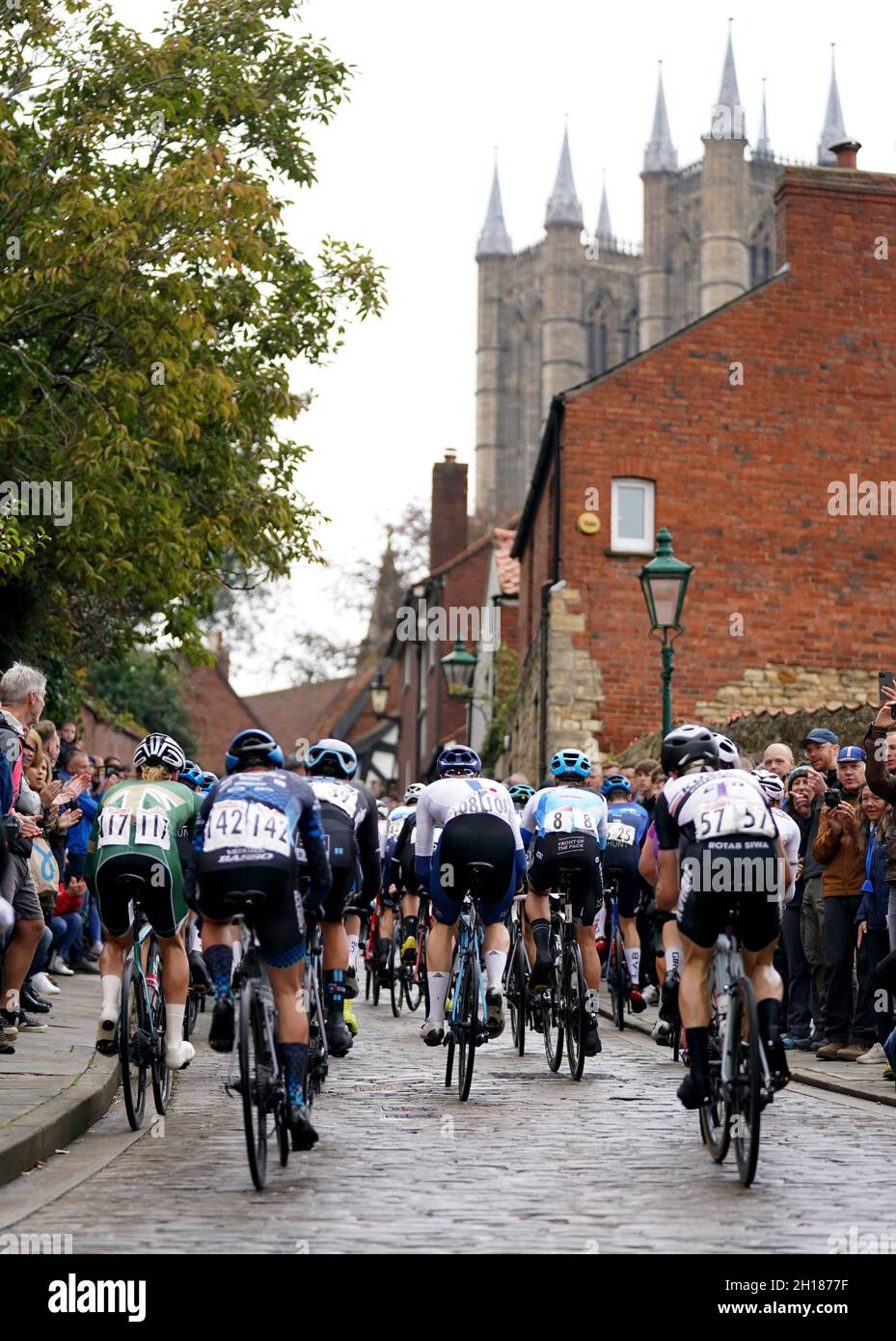 Riders make their way up Michaelgate during the Men's Road Race during the British Cycling National Championships Road Race through Lincoln. Picture date: Sunday October 17, 2021. Stock Photo