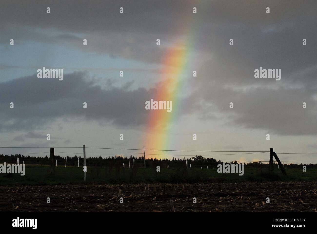 Rainbow against a dark sky hi-res stock photography and images - Alamy