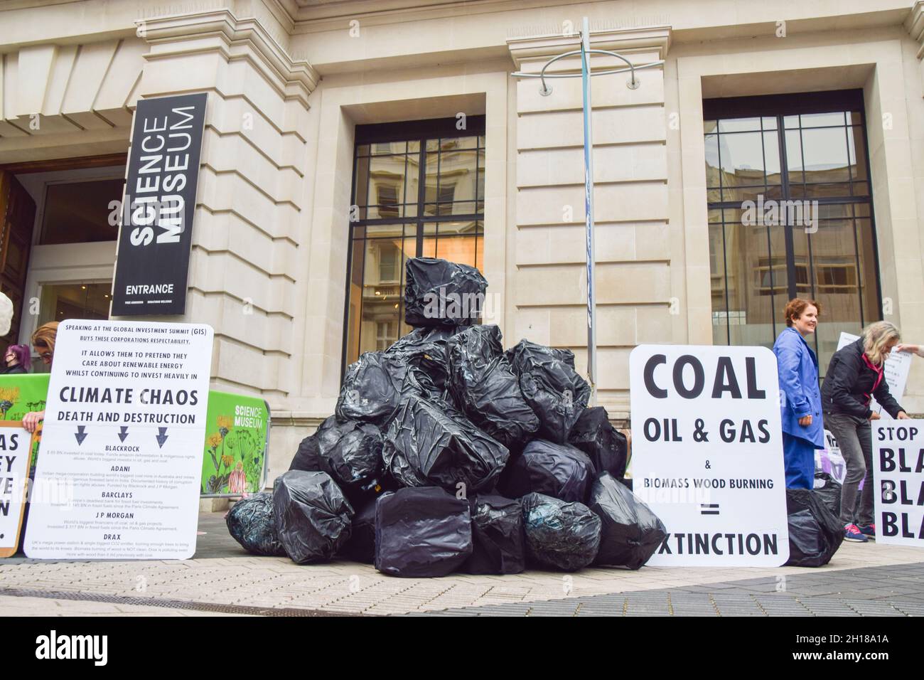 London, UK. 17th Oct, 2021. Bags made to look like large lumps of coal outside the Science Museum. Extinction Rebellion activists gathered outside the museum in South Kensington ahead of the Global Investment Summit, taking place on 19th October, in protest against what they say is a 'greenwash platform' for some of the world's top polluters and companies financing fossil fuels. Credit: Vuk Valcic/Alamy Live News Stock Photo