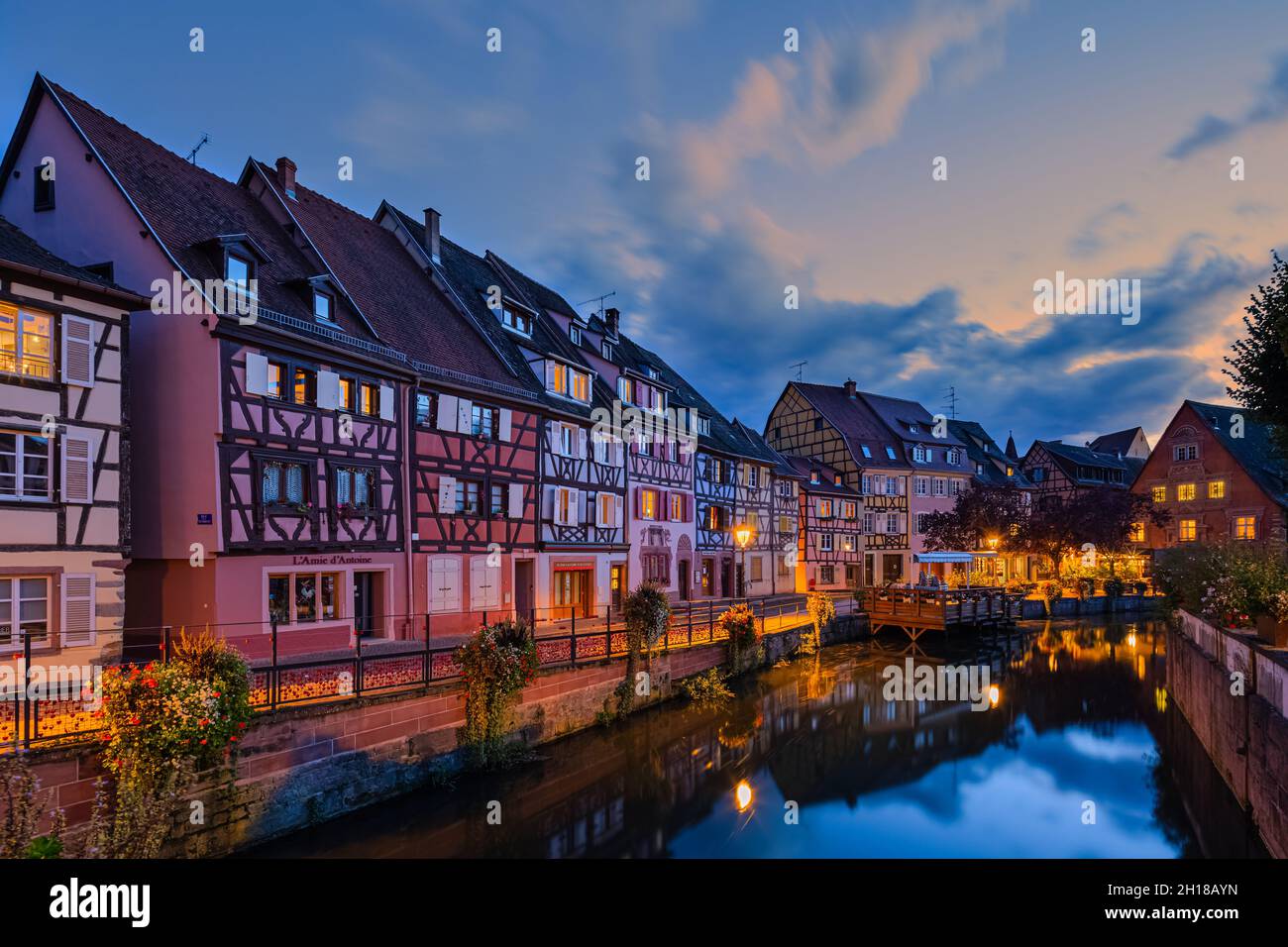 An evening at Colmar, with traditional colorful half-timbered houses in the Alsace region, France. Colmar is a city and commune in the Haut-Rhin depar Stock Photo