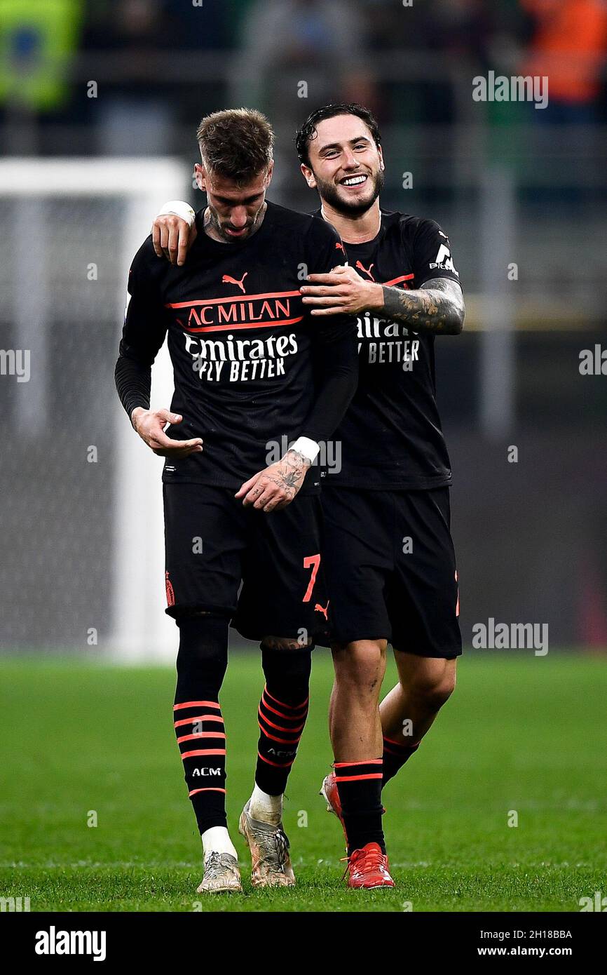 Milan, Italy. 16 October 2021. Samu Castillejo (L) of AC Milan celebrates the victory with Davide Calabria of AC Milan at the end of the Serie A football match between AC Milan and Hellas Verona FC. Credit: Nicolò Campo/Alamy Live News Stock Photo