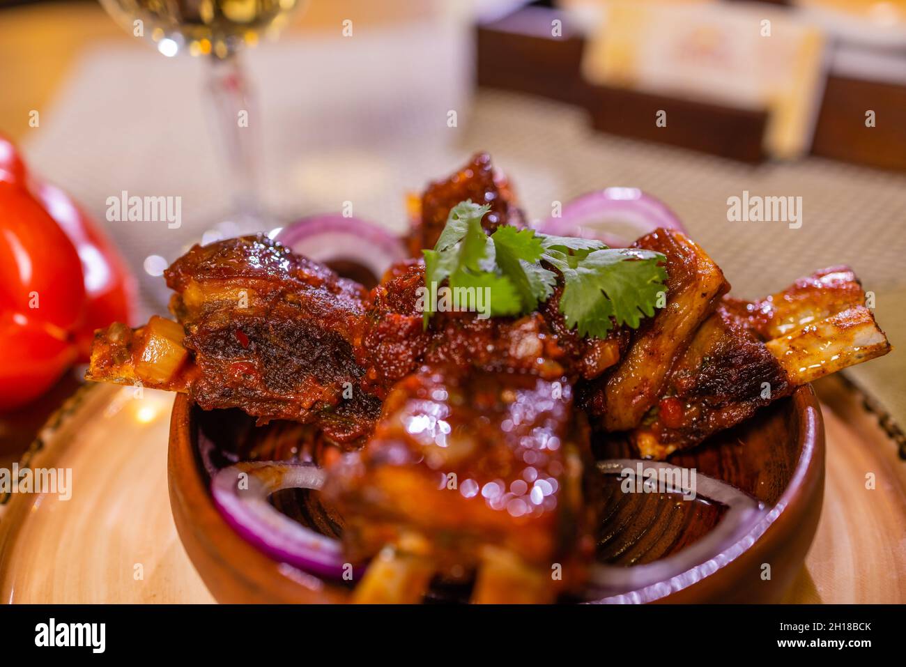 grilled ribs with pickles and onion. close-up Stock Photo - Alamy
