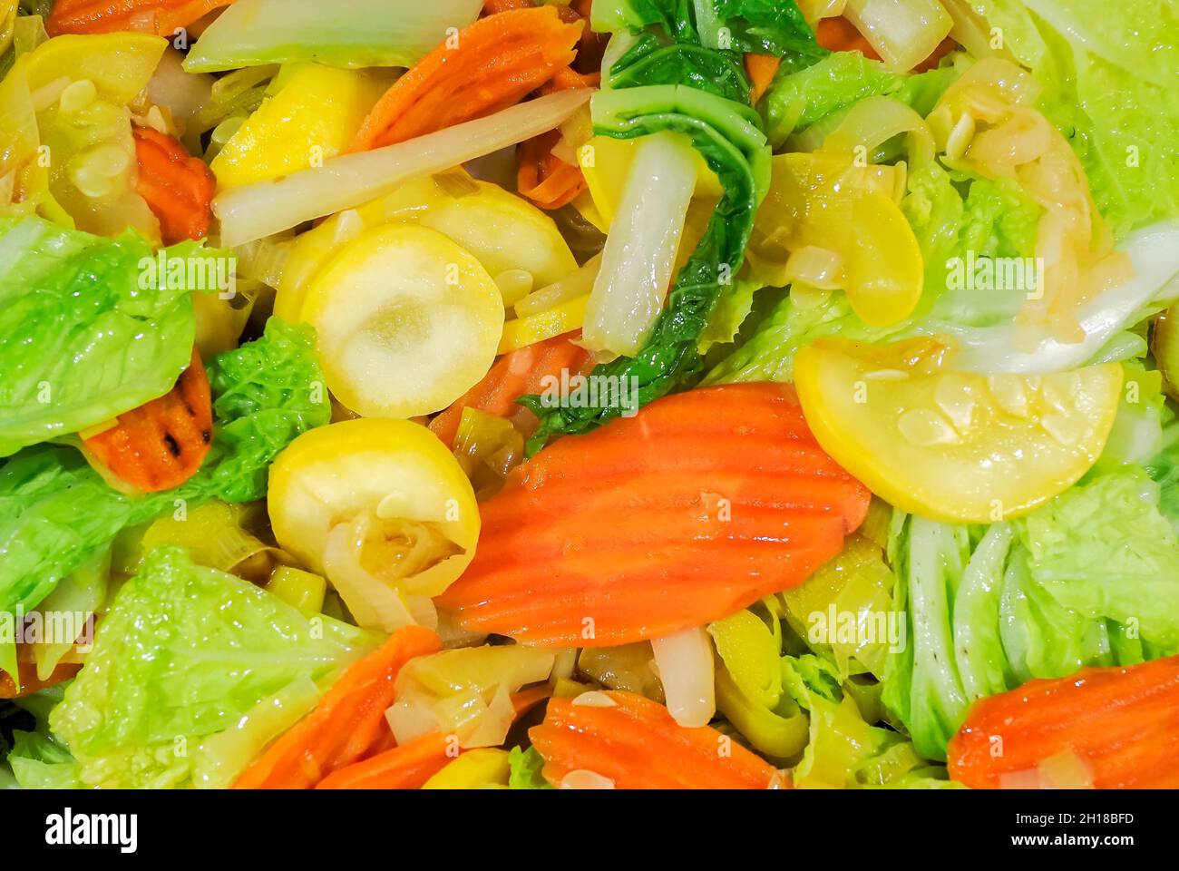 Cloae up of vegetable stir fry with carrots, onions, zucchine and chinese cabbage Stock Photo