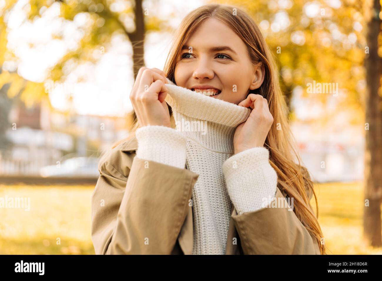 Woman pulls up sweater High Resolution Stock Photography and Images Alamy