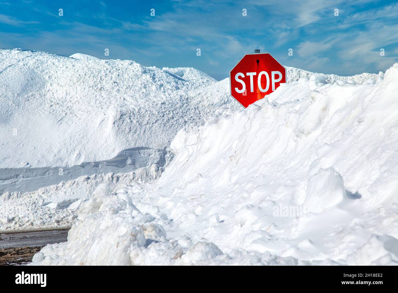 Stop sign in a snowbank. Stock Photo