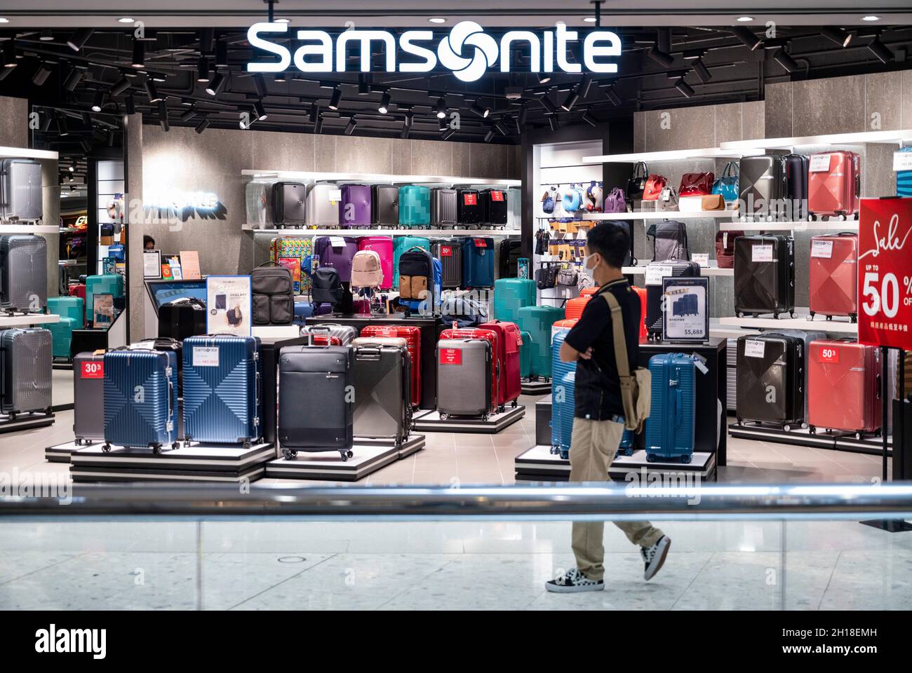 A shopper walks past the American luggage manufacturer and retailer