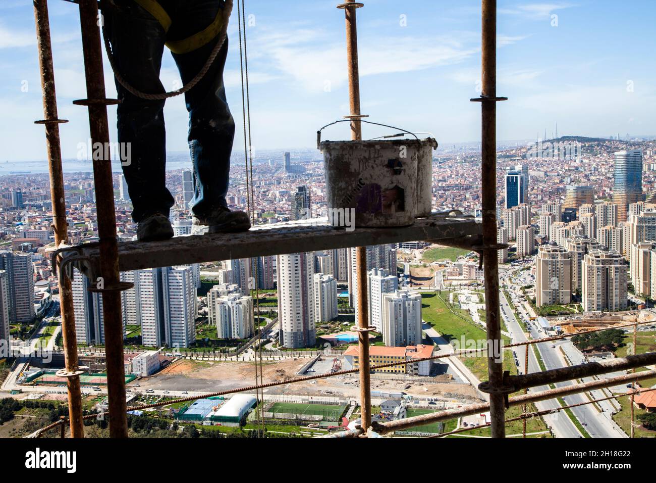 Istanbul,Turkey - 04-02-2013:Seat belt not fastened when construction worker is working in an elevated place Stock Photo