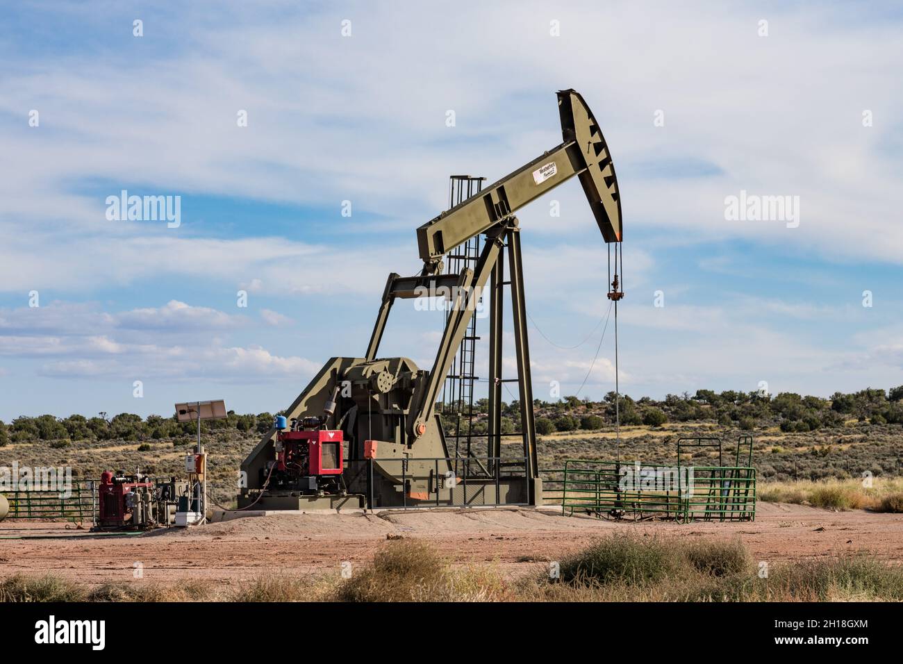 A conventional horsehead oil well pump jack unit on an oil well site in Utah. Stock Photo