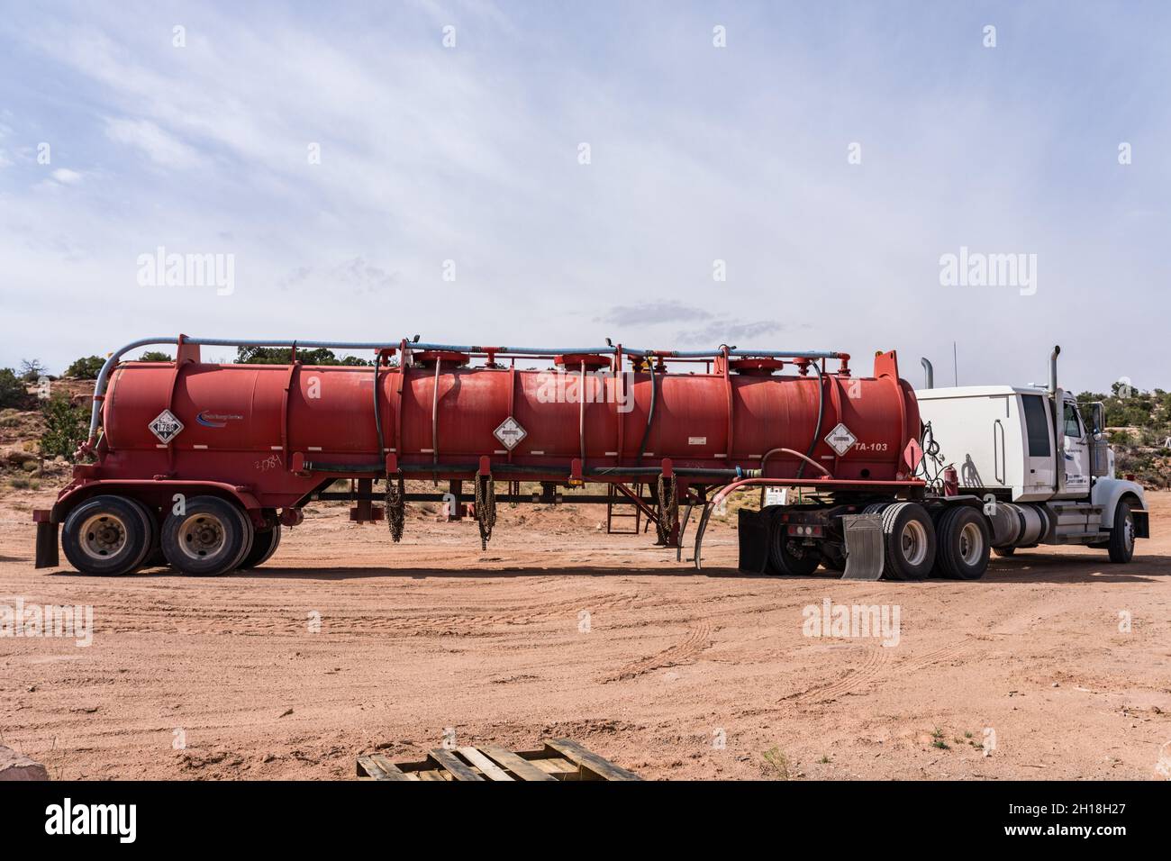 An acid tanker carrying acid for acidizing an oil well to restore production.  Utah. Stock Photo