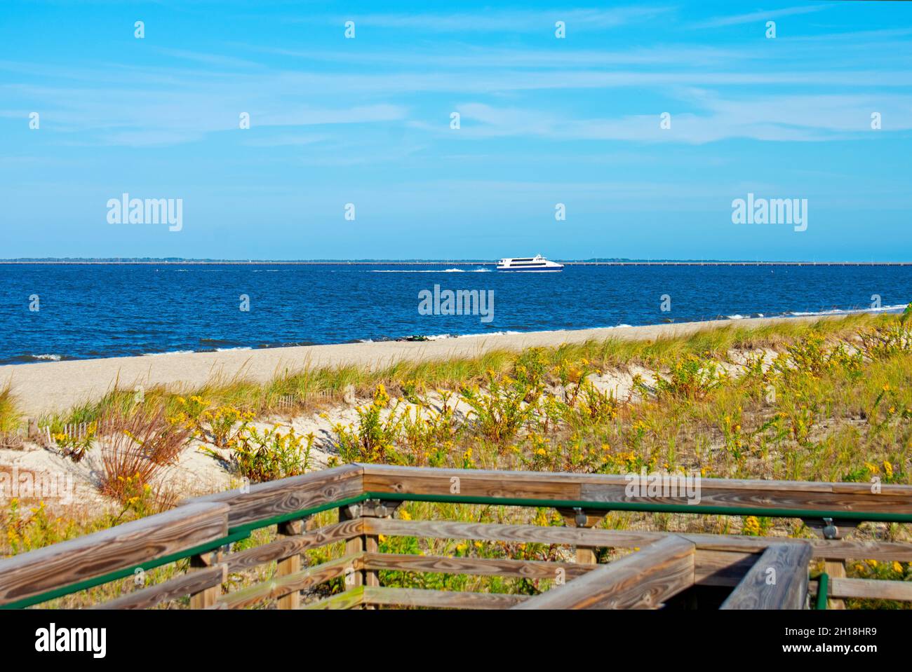 Beach, sand, and grass flowing in the breeze at the Bayshore Waterfront Park in Port Monmouth, New Jersey, on a sunny day -03 Stock Photo