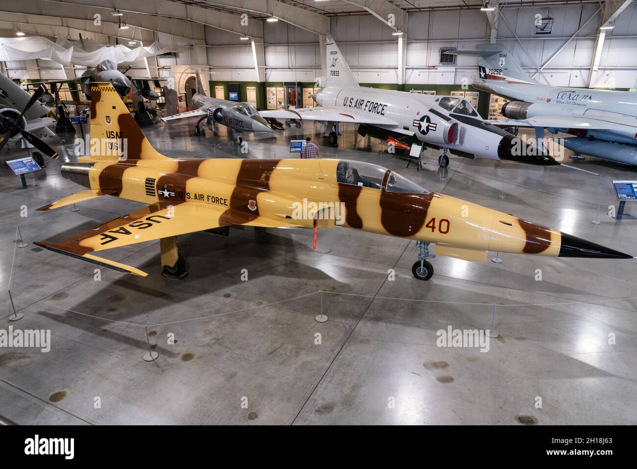 A Northrop F-5E Tiger II light fighter aircraft in the Hill Aerospace Museum in Utah.  Behind are an F-102 Delta Dagger and an F-104 Starfighter. Stock Photo