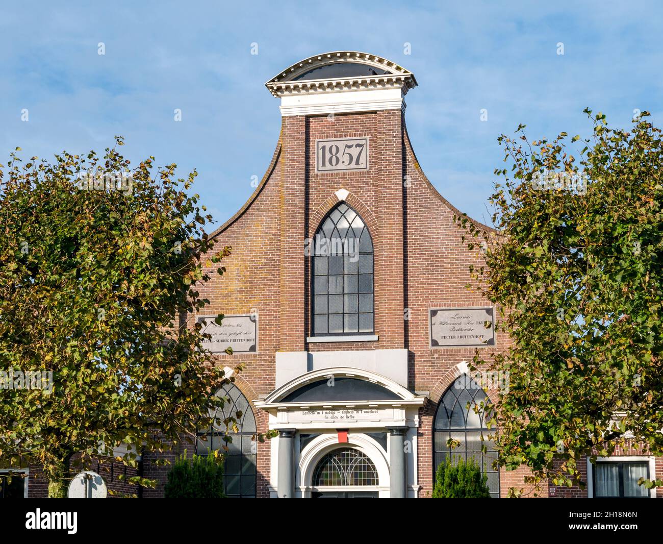 Top of front facade of Baptist Church in city of IJlst, Friesland, Netherlands Stock Photo