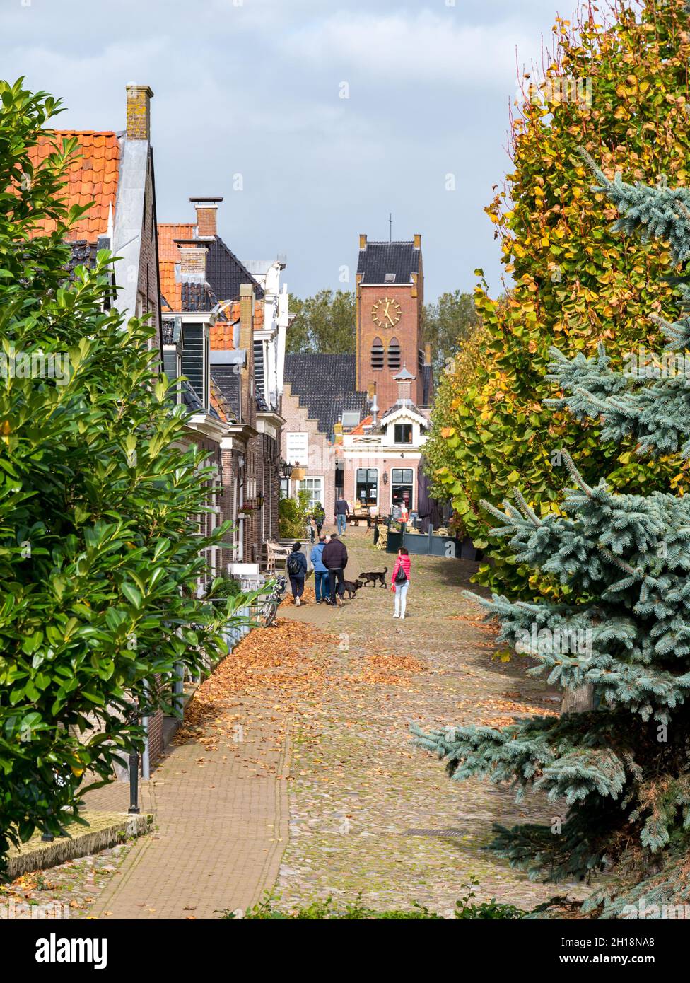 Street scene of Voorstreek with people walking in city of Sloten, Sleat, in Friesland, Netherlands Stock Photo