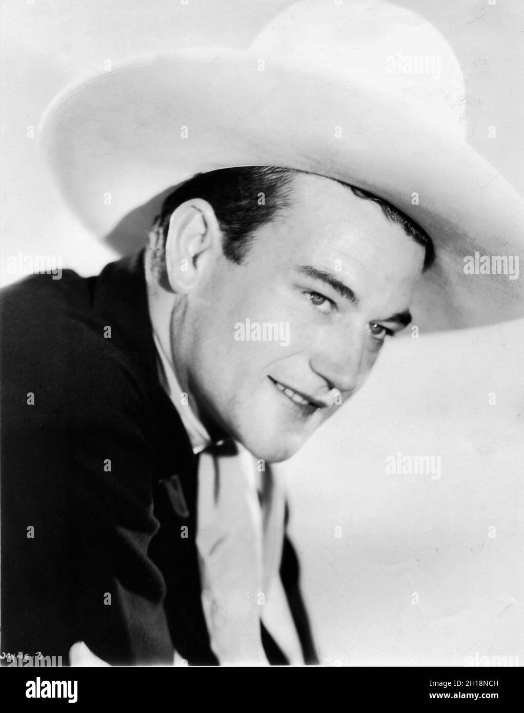 JOHN WAYNE Cowboy Portrait in THE BIG STAMPEDE 1932 director TENNY WRIGHT A Four Star Western from Leon Schlesinger Studios distributed by Warner Bros. Stock Photo
