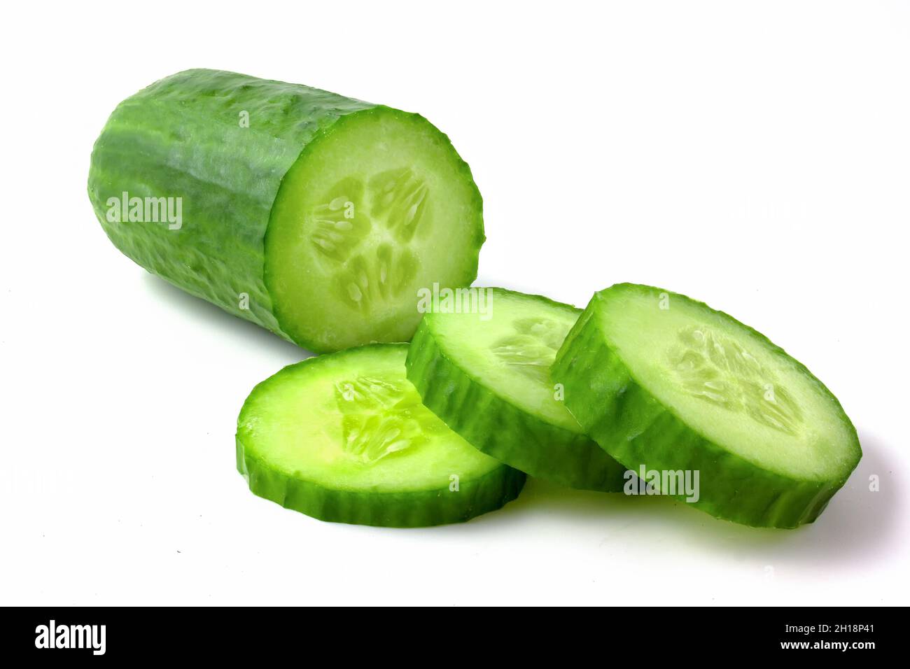 Cucumber and slices isolated on white background. Stock Photo