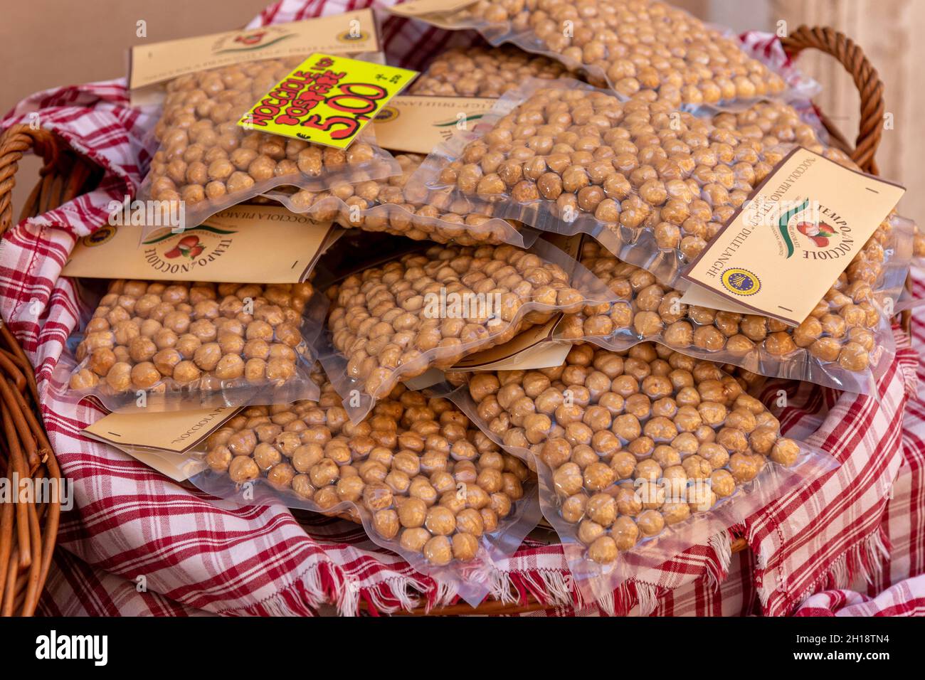 Alba, Cuneo, Italy - October 12, 2021: Piedmont IGP hazelnuts from Langhe, round and gentle,  toasted in vacuum packed sealed on sale Stock Photo