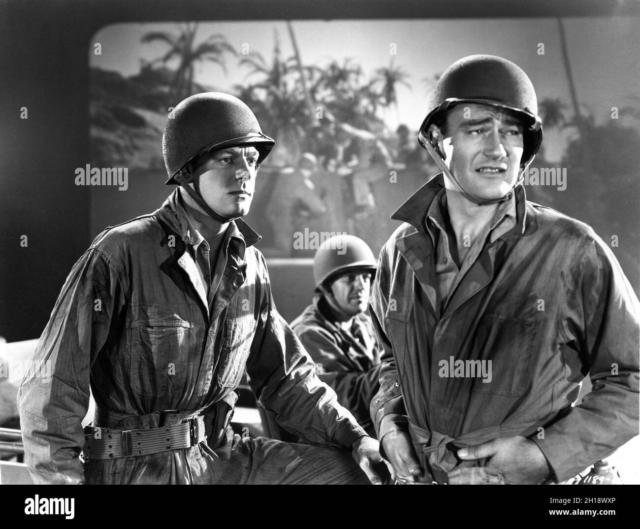 DENNIS O'KEEFE and JOHN WAYNE in front of Back Projection Screen in THE ...