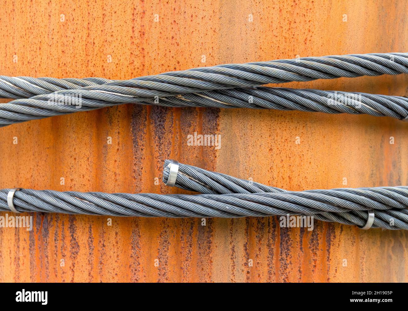 Closeup shot of wire ropes on rusty ground Stock Photo Alamy