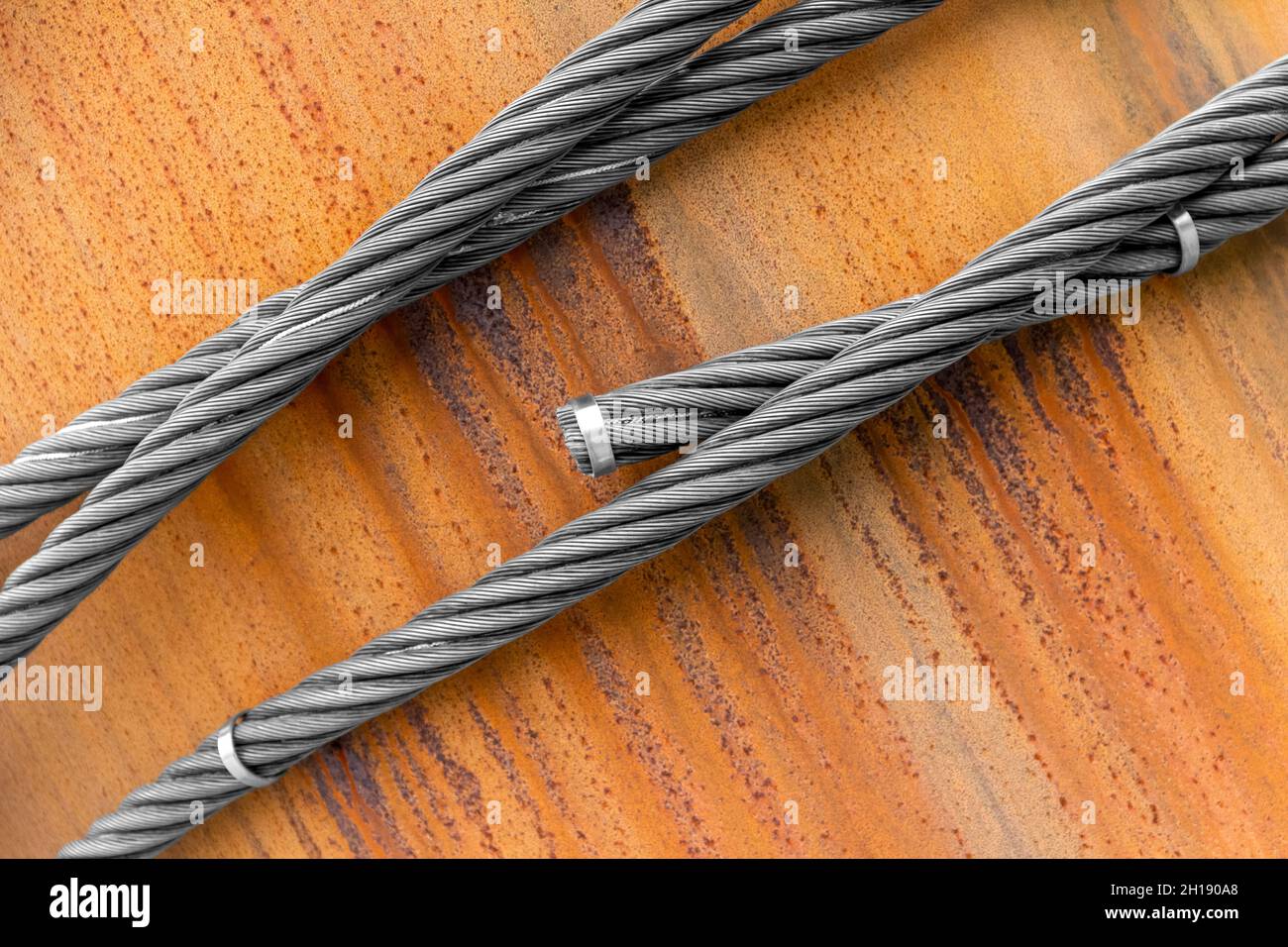 Closeup shot of wire ropes on rusty ground Stock Photo Alamy