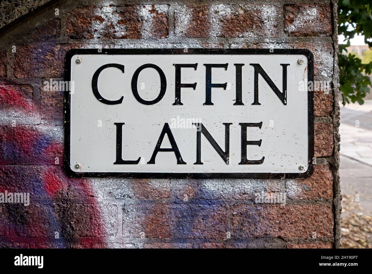 Coffin Lane, street sign on a wall outside Dapry Cemetery, Edinburgh, Scotland, UK. Stock Photo