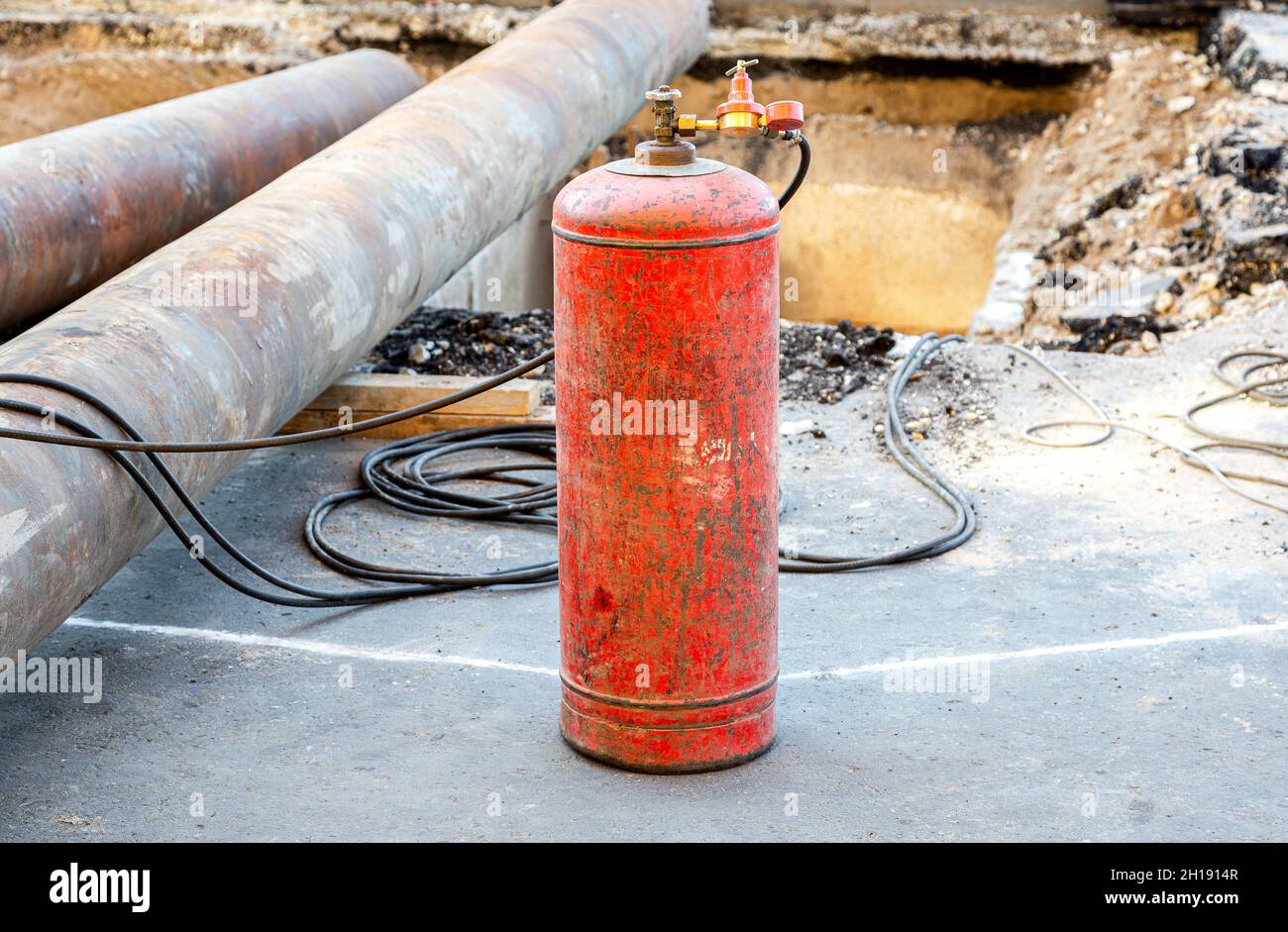 Red acetylene cylinder with pressure sensors on the gearbox. Equipment for  gas cutting of metal. Gas welding equipment for cutting metal at a construc  Stock Photo - Alamy
