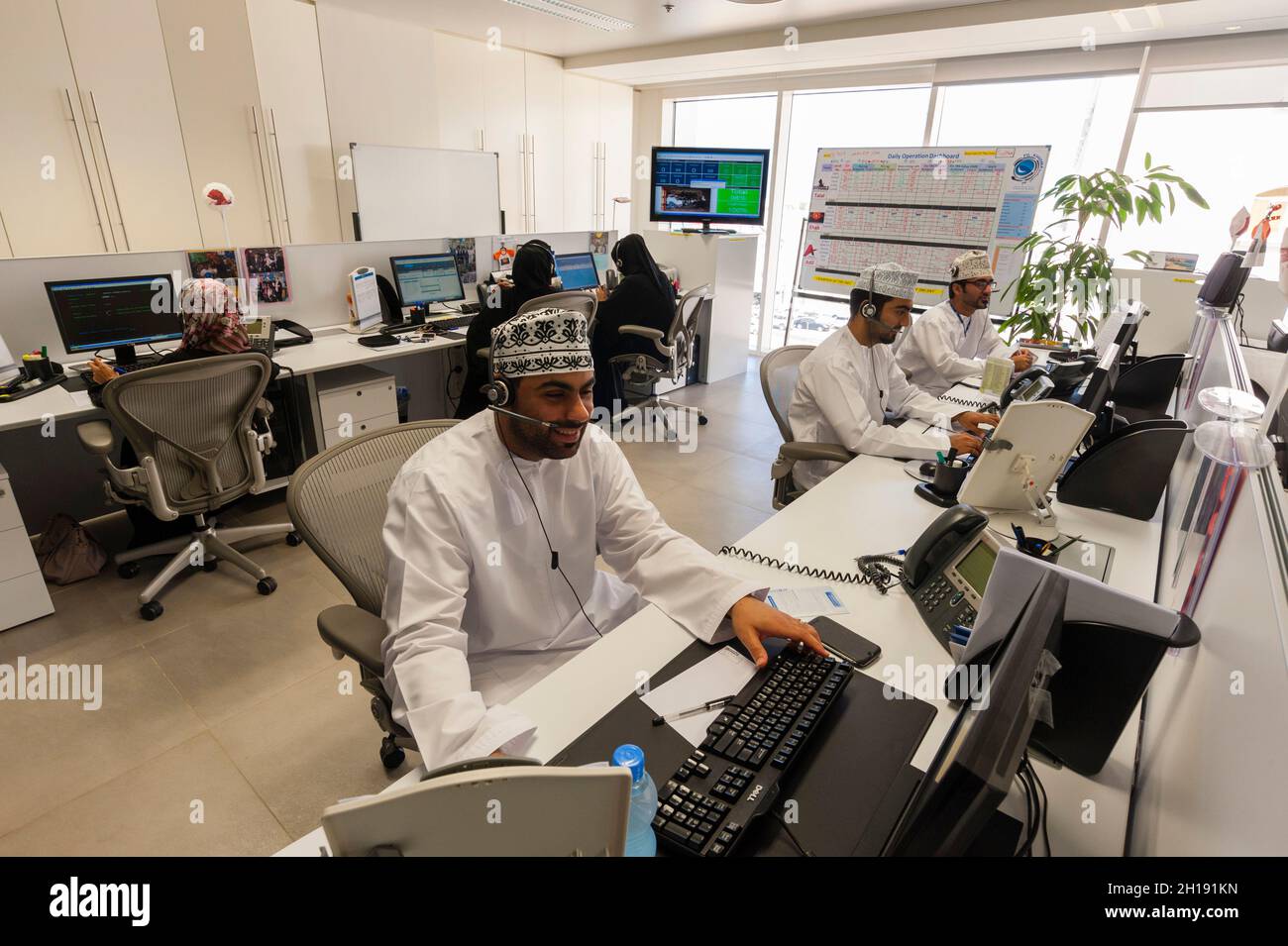 Employees working in the call center of the Oman Arab bank. Muscat, Oman. Stock Photo