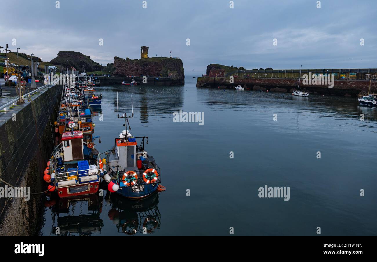 Dunbar, East Lothian, Scotland, UK, 17th October 2021. Pictured: Dunbar Castle is lit up at night as a signal about climate change for COP26 Stock Photo