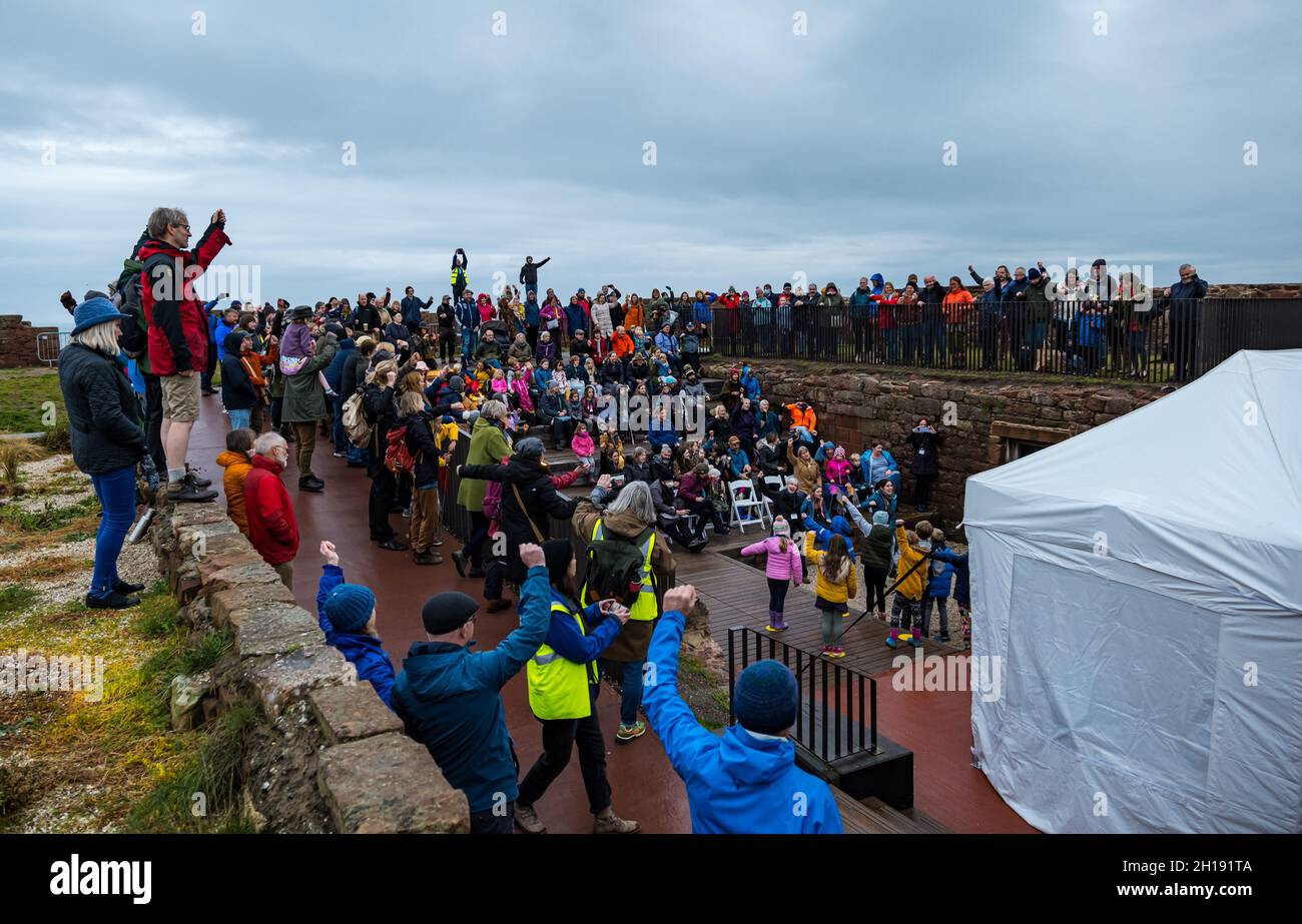 Dunbar, East Lothian, Scotland, UK, 17th October 2021. Cop26 Pilgrimage: climate activists stop in Dunbar for a day of activities. Pictured: people gather in Dunbar Battery for entertainment Stock Photo