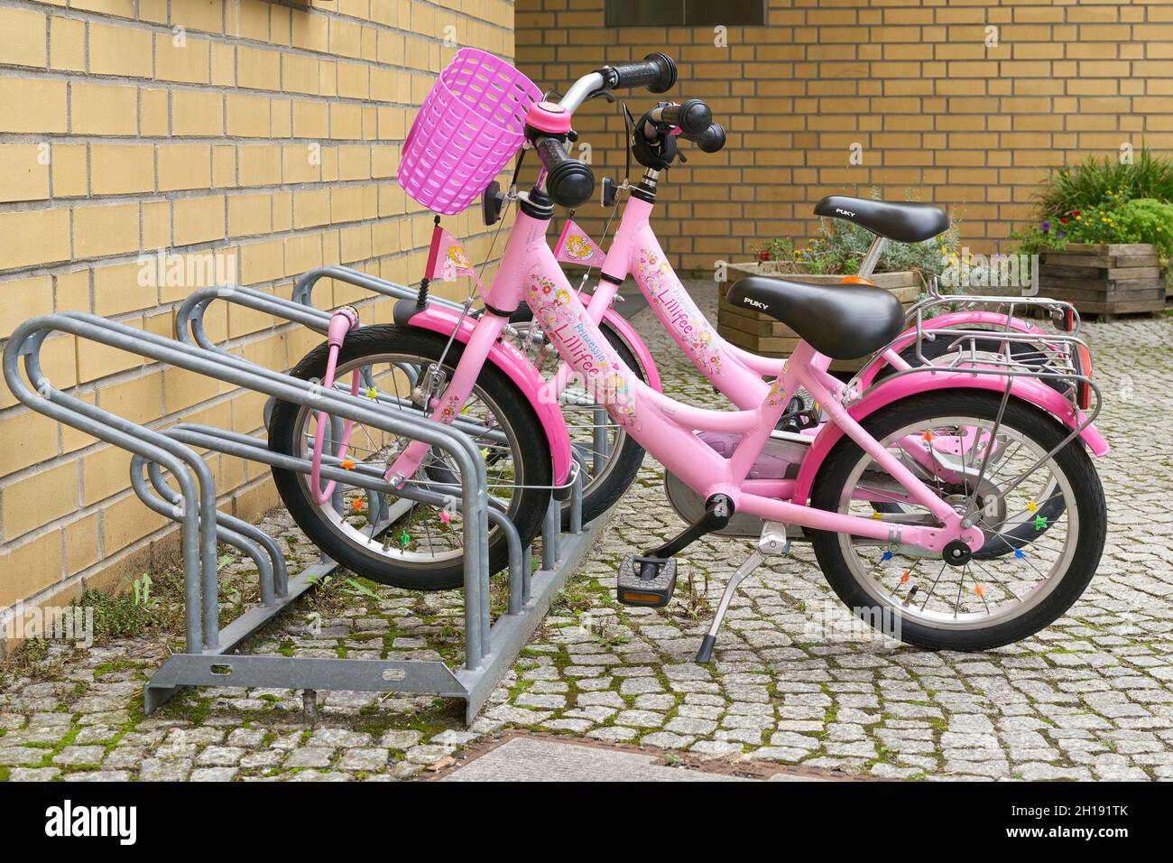 diepvries ingenieur blouse pink bicycles as merchandising of the product line Lillifee from the german  publishing house Coppenrath in front of a kindergarten in Berlin Stock  Photo - Alamy