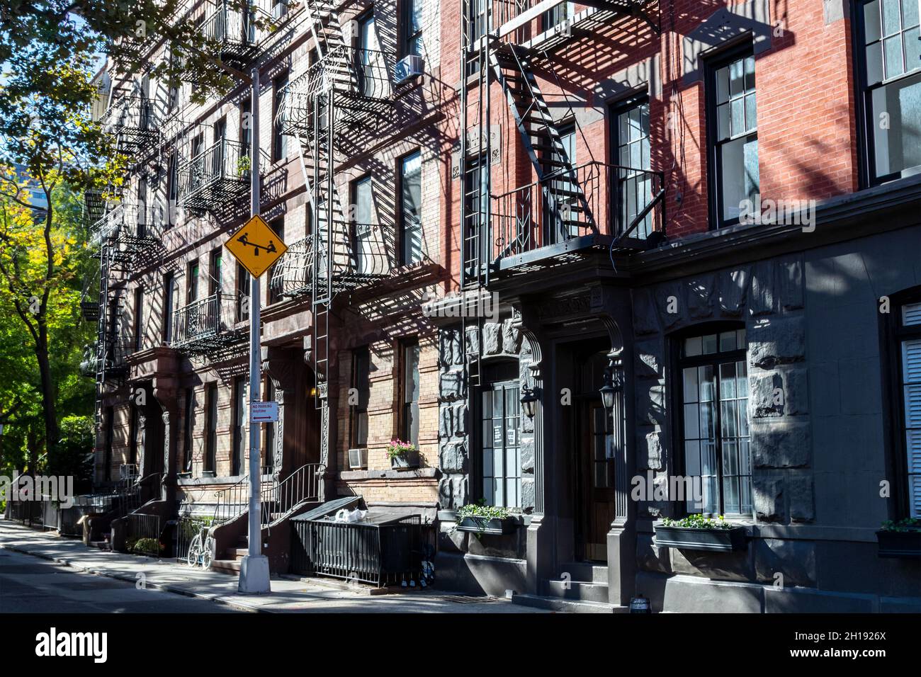 Sunlight shines on a block of historic buildings on Leroy Street in the