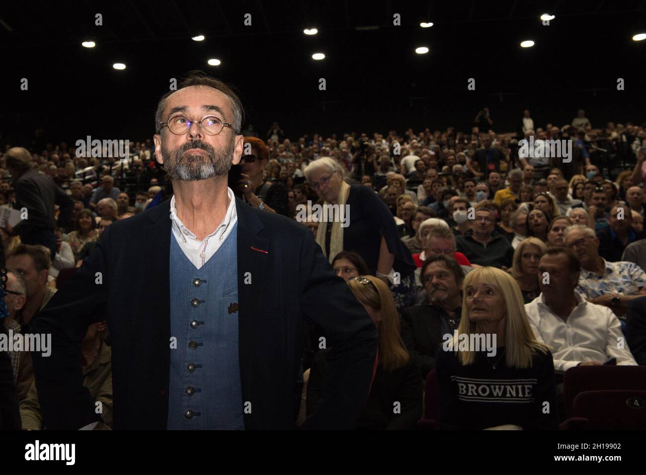 Beziers, France. 16th Oct, 2021. Robert Menard seen in the place of the meeting with the audience in the background.Robert Menard, close to the Rassemblement National of Marine Le Pen has invited Eric Zemmour to a dedication meeting on October 16, 2021. He insisted in his speech in a necessary alliance between Marine Le Pen and Eric Zemmour to make win the camp of the 'national right'. Credit: SOPA Images Limited/Alamy Live News Stock Photo