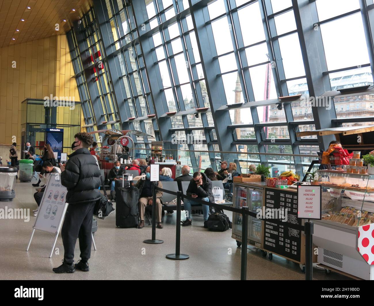 The new concourse overlooking George Square, with cafe and seating, part of the £120m redevelopment of Queen Street Station in Glasgow city centre. Stock Photo