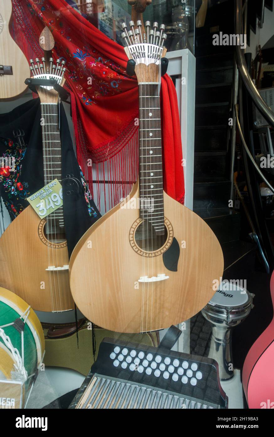 Portuguese guitar or fado guitar displayed in a store, Porto, Portugal. Stock Photo