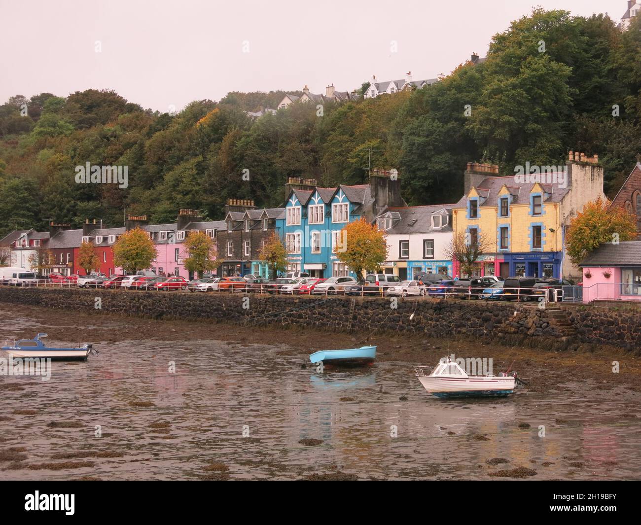 The colourful buildings on the main street in Tobermory, overlooking the harbour and the Sound of Mull; Inner Hebrides, Scotland Stock Photo