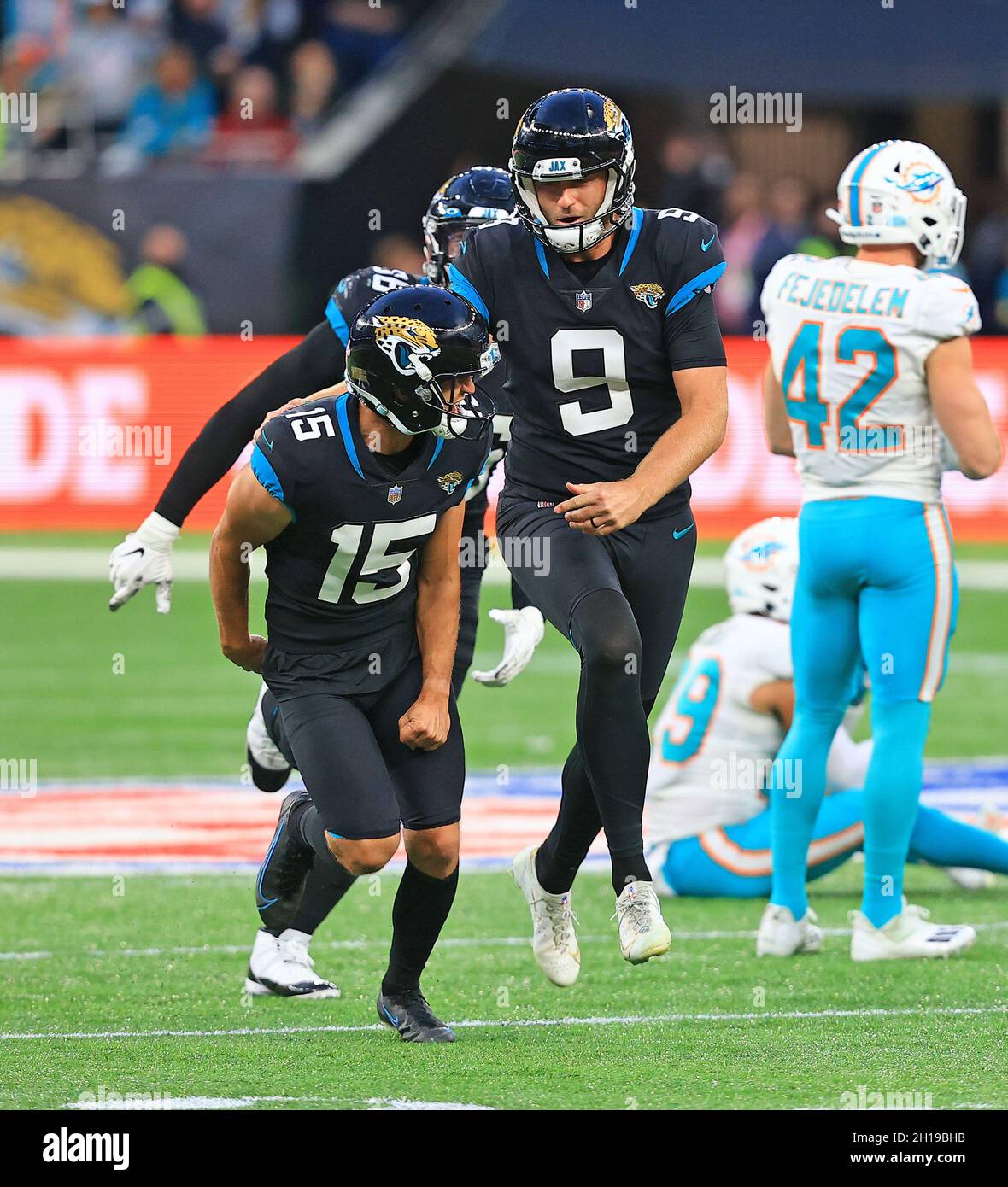 London, UK. 17th Oct, 2021. Jacksonville Jaguars kicker Matthew Wright (R)  celebrates victory with Miami's Blake Ferguson after last second kick in  their match against the Miami Dolphins at White Hart Lane