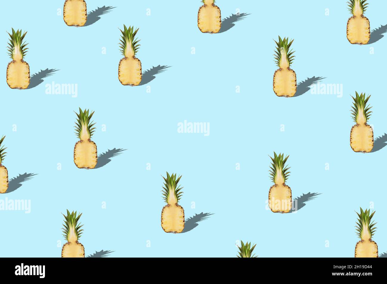 Creative pattern with pineapple on blue background. Minimal summer concept. Stock Photo