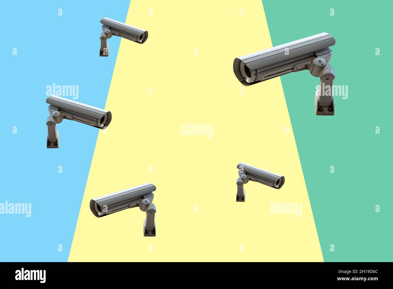 Few security cameras on colorful wall. Minimal creative concept. Stock Photo