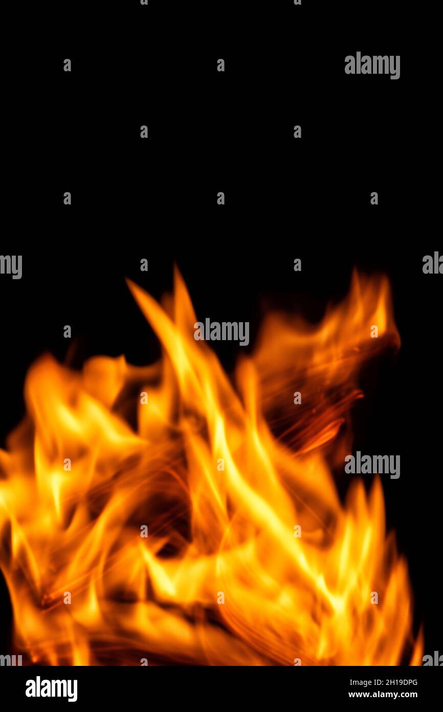 Fire flames isolated on a black backdrop. Abstract fire background. Stock Photo