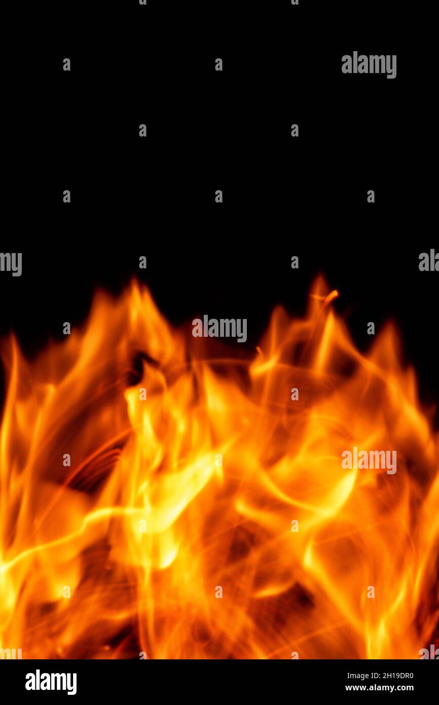 Fire flames isolated on a black backdrop. Abstract fire background. Stock Photo