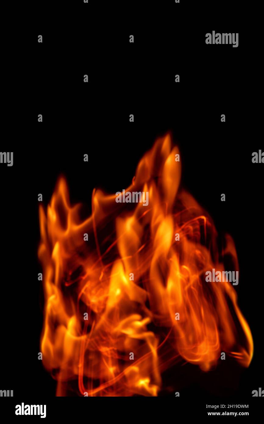 Fire flames isolated on a black backdrop. Abstract fire background. Stock Photo