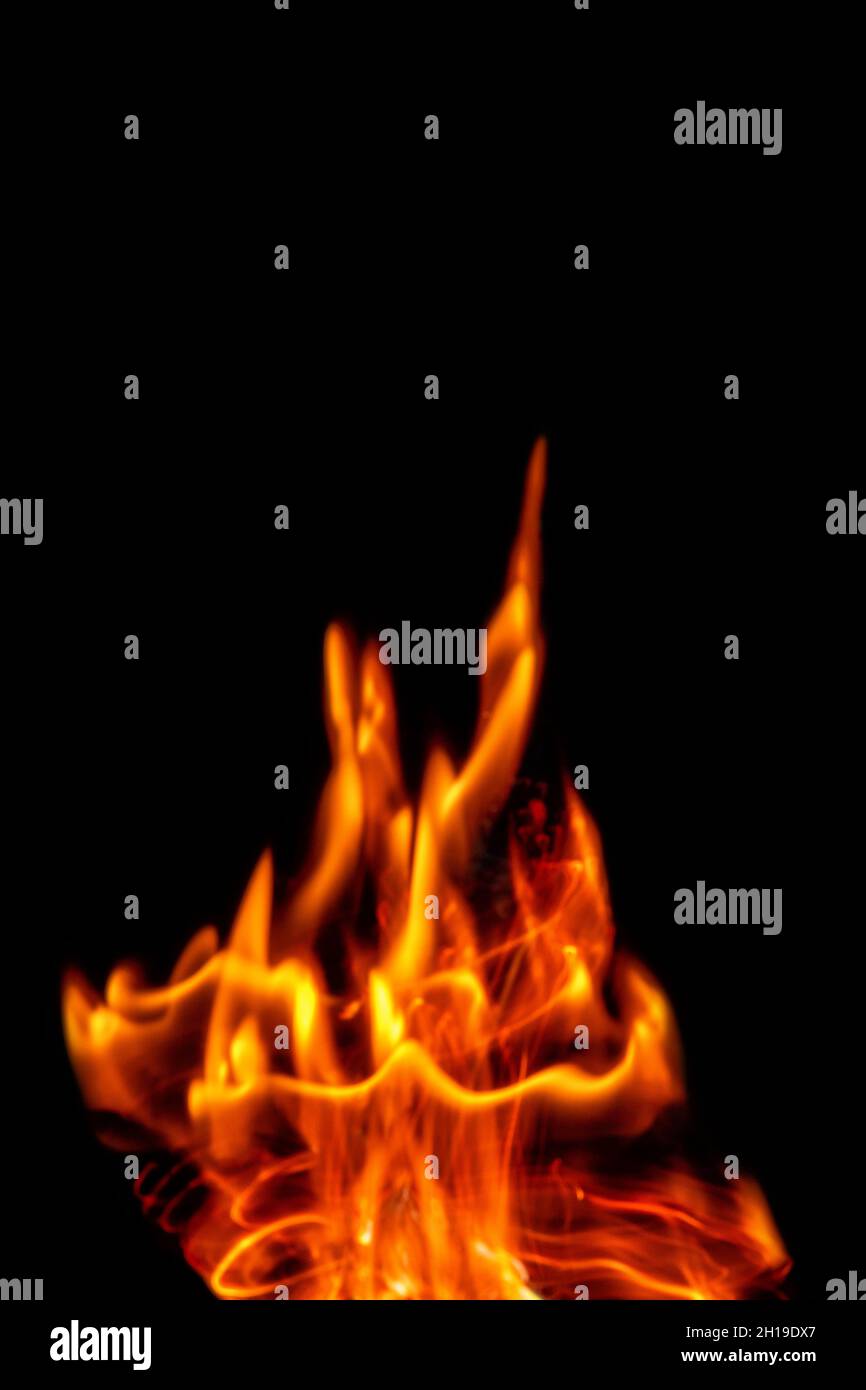 Fire flames isolated on a black backdrop. Abstract fire background. Stock Photo