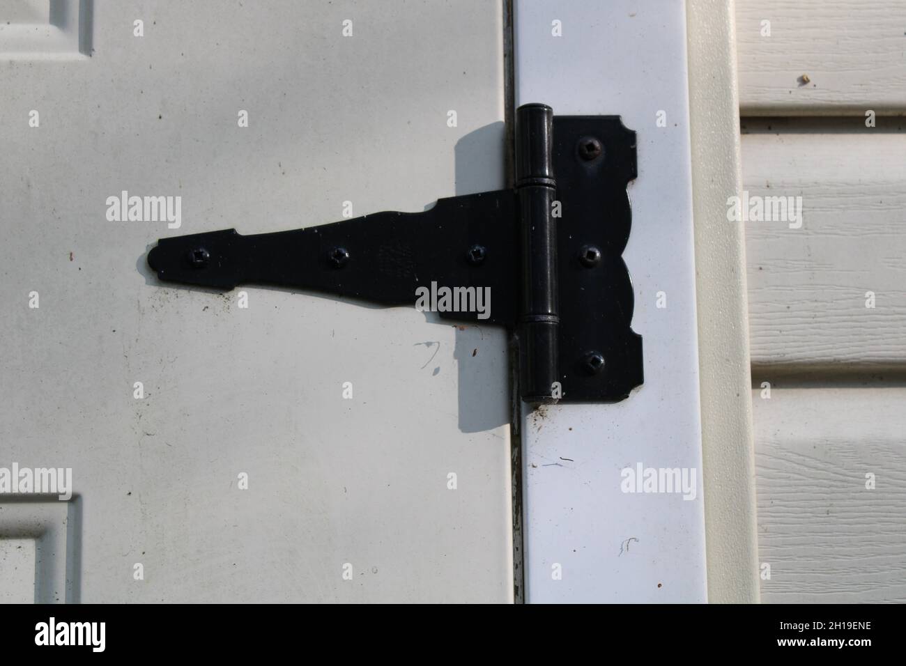 A Common Black Metal Hinge on a Shed Door Stock Photo Alamy