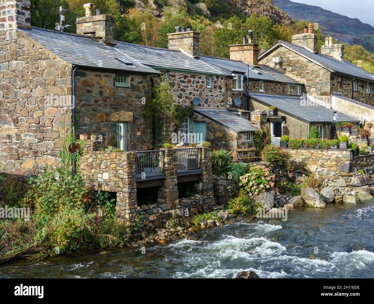 village property constructed in local stone from the 18th century on the afon Colwyn in