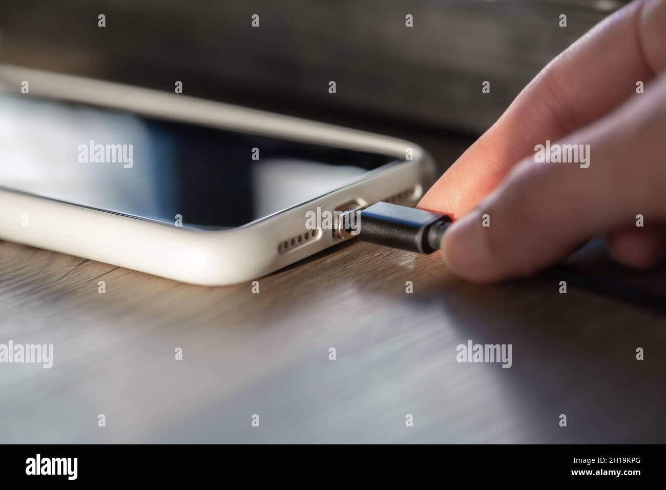 Magnetic cable for charging smartphone, close up. Stock Photo