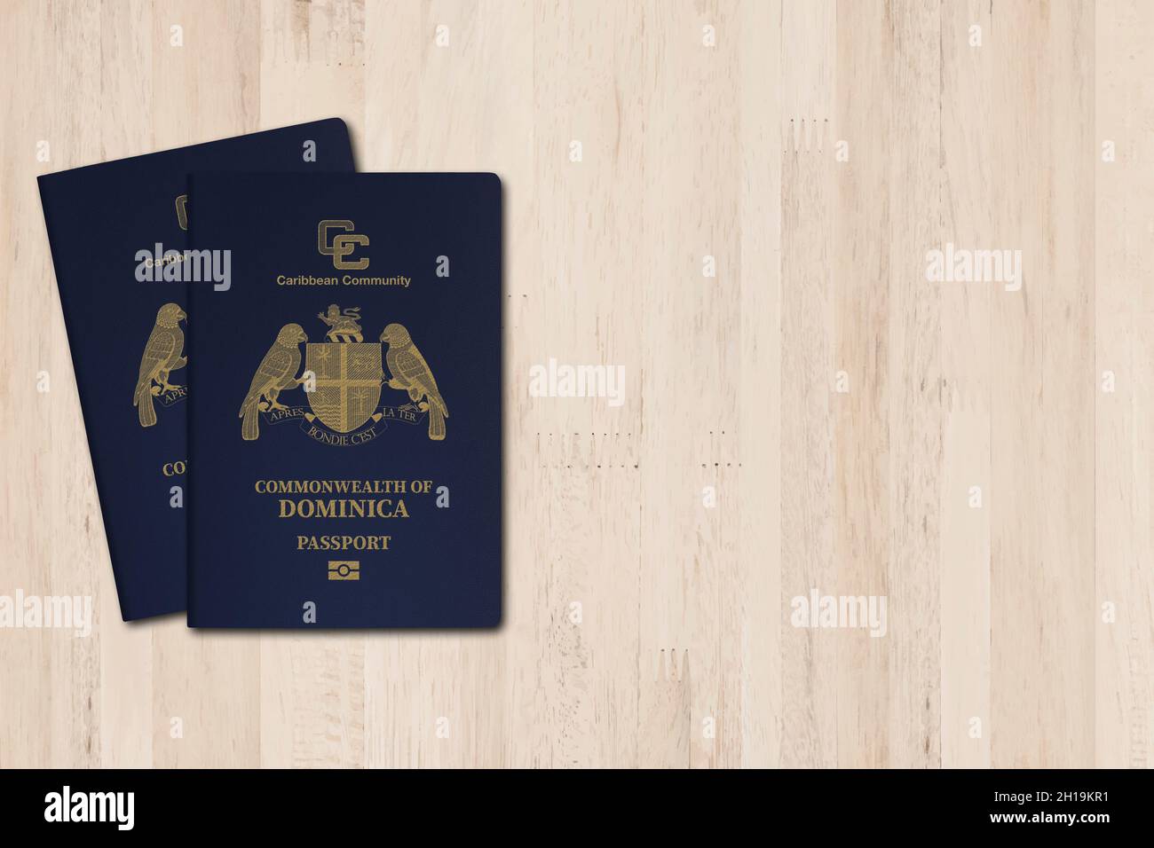 The Dominica passport is issued to citizens of the Commonwealth of Dominica for international travel, Dominica passport on a wooden background Stock Photo