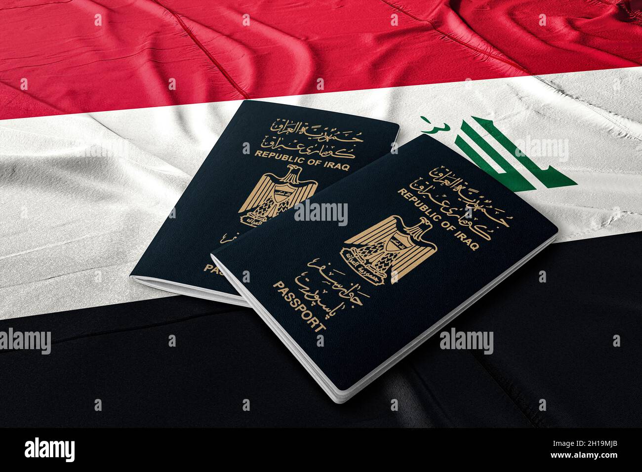 Iraqi passport on the flag of the State of Iraq Stock Photo