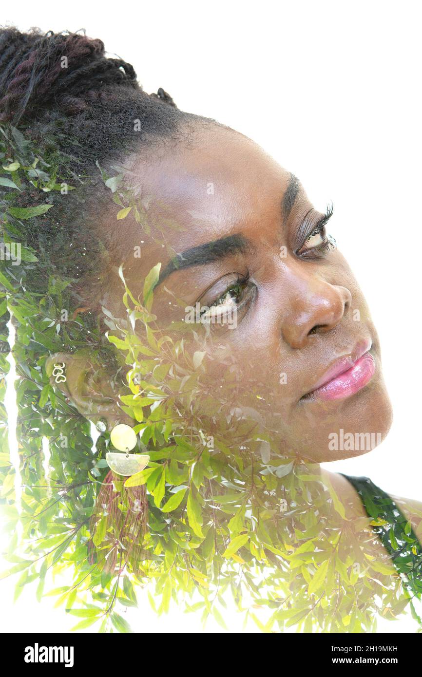 Double exposure portrait of beautiful woman with a creative hairstyle ...