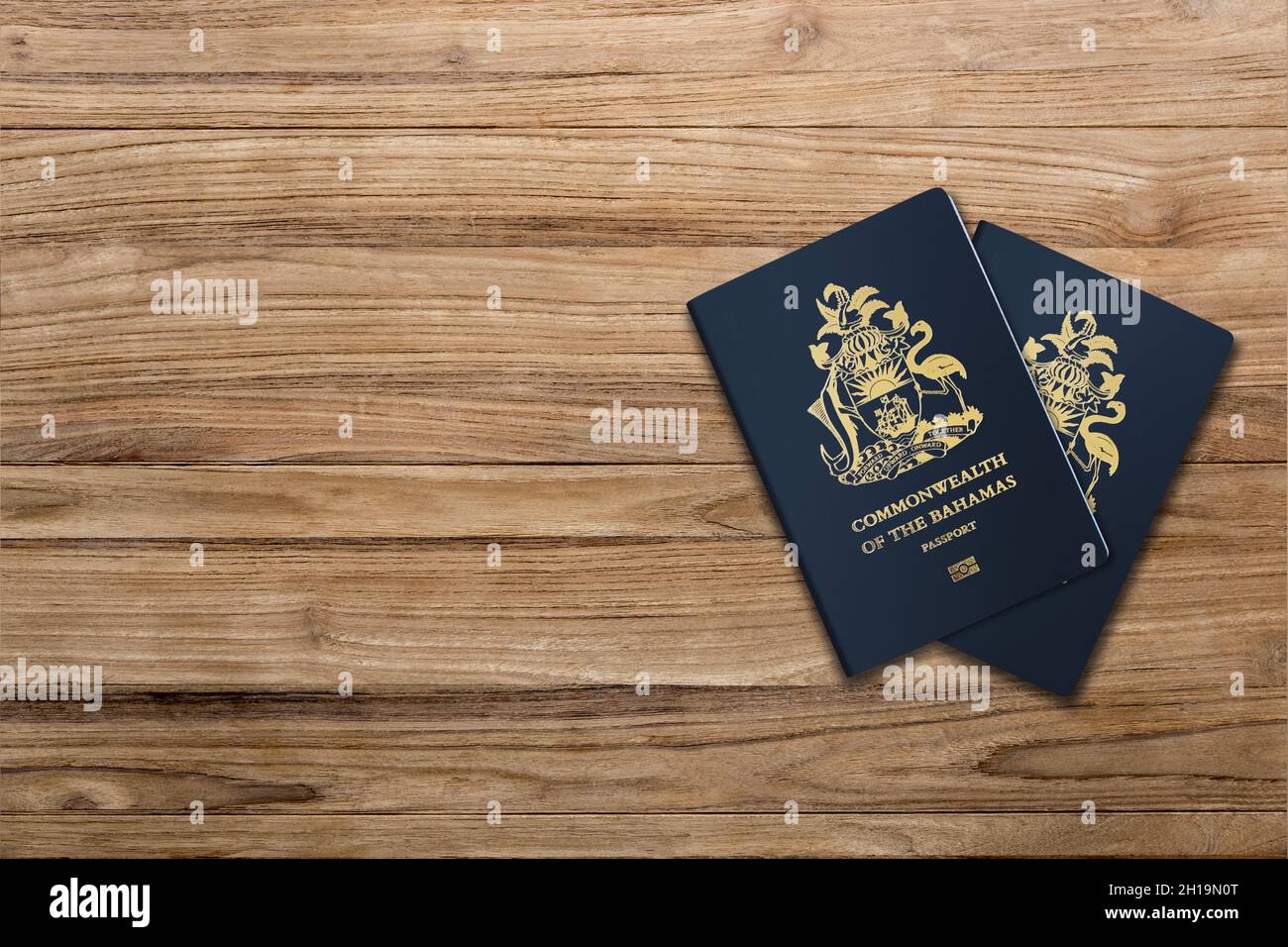Bahamas passport on a wooden board Stock Photo