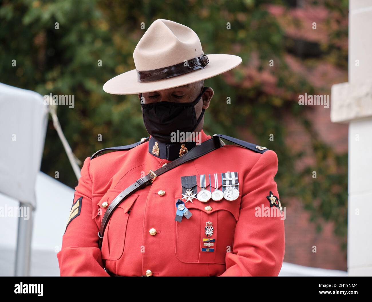 Halifax, Canada.  Annual Memorial for Nova Scotia Fallen Peace Officers’ in line of duty. RCMP officer taking moment of silence for fallen officers Stock Photo