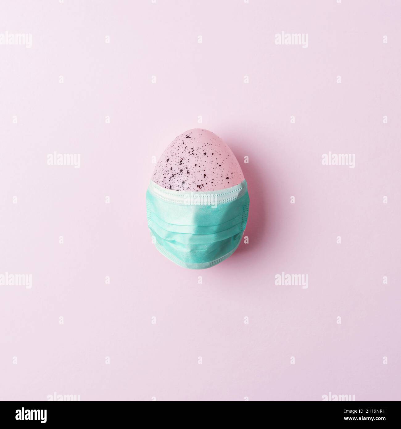 Colorful Easter egg on pink background. Minimal Easter concept. Flat lay. Stock Photo